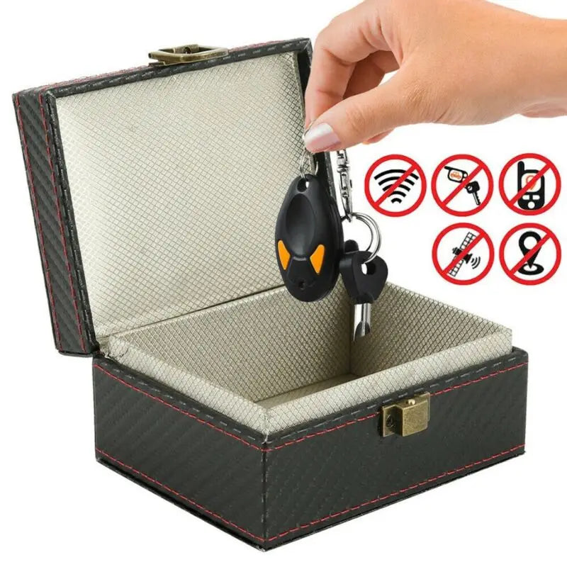 Black key fob storage box shown with two key fobs inside